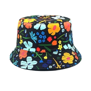 Detail showing colorful floral print on black canvas fabric with reinforced stitching