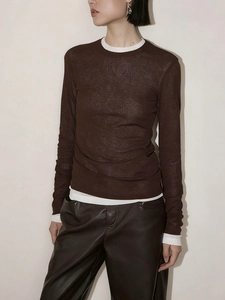 Detail of dark brown thin knit top with bamboo texture and contrast collar neckline