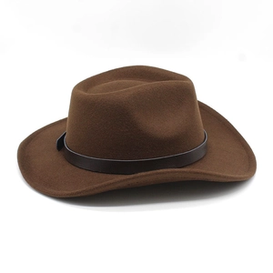 Close-up of brown wool felt cowboy hat with decorative dark leather band on white background