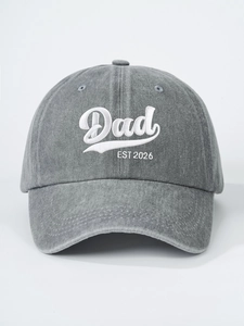 Detail of white 3D embroidery showing Dad EST 2026 on grey washed denim baseball cap