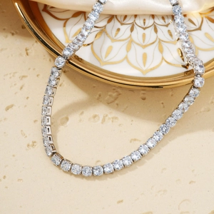 Elegant silver tennis necklace with sparkling cubic zirconia on white mandala porcelain