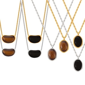 Collier vintage avec pendentif œil de tigre et onyx en finitions or et argent