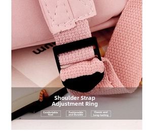 Detail of adjustable strap buckle on a pink backpack with durable woven fabric texture