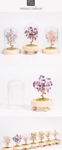 Macro detail of natural crystal tree with metal wire branches and elegant glass dome cover