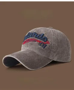 Detailed close-up of embroidered Mando text on vintage washed canvas baseball cap