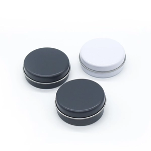 Close-up of black and white 20g mini round tin cans with lids for cosmetic packaging