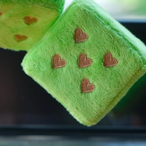 Green plush dice car hanging ornament with brown heart embroidery details