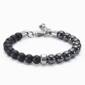 Macro shot of 8mm matte black and hematite beads with a silver stainless steel clasp