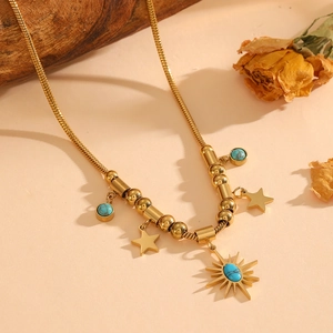 Vintage gold necklace with sun pendant, turquoise beads and star charms on snake chain