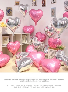 Detail of pink and silver heart-shaped aluminum foil balloons for party decoration