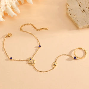 Bohemian gold plated stainless steel hand chain with blue evil eye and Hamsa hand charms