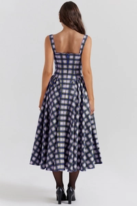 Detail view of the back zipper and checkered purple and green pattern on the long dress