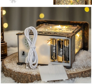 Detailed base of festive lantern showing dual power modes with USB cable and battery slots