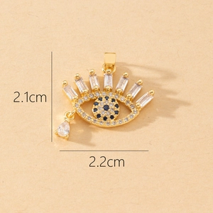 Macro shot of evil eye pendant with cubic zirconia inlay measuring 2.1cm by 2.2cm