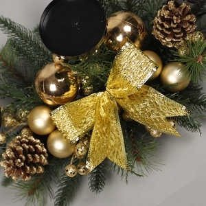 Golden Christmas ball and pine cone candle holder centerpiece with festive green pine needles