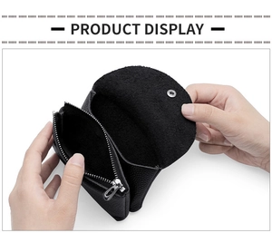 Detail of black genuine leather coin purse showing snap button and side zipper closure