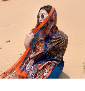 Ethnic pattern sun protection shawl wrap worn by a model in a desert environment