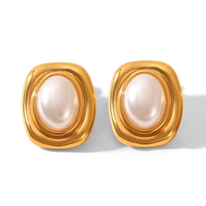 Macro detail of retro gold earrings with oval faux pearls and thick metal frames
