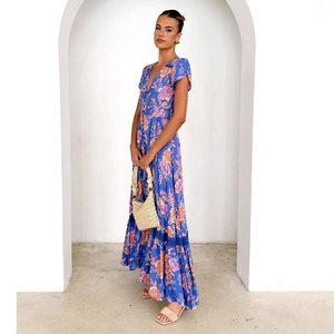 Bohemian V-neck floral maxi dress with ruffled hem and waist tie for summer holidays