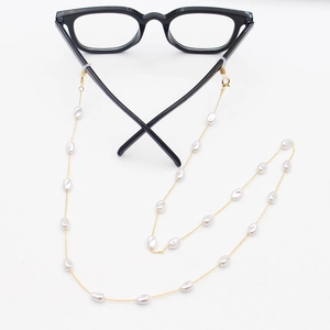 Elegant gold metal eyewear chain with white irregular pearls and secure silicone loops