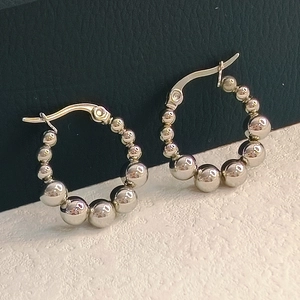 Polished silver beaded hoop earrings with a minimalist ball design for modern fashion style