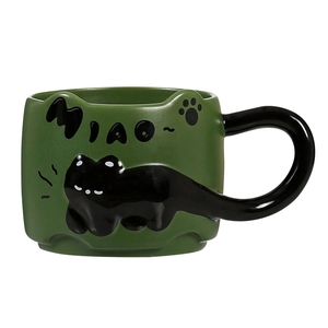 Cute green ceramic mug with 3D black cat relief design and creative cat tail handle