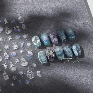 Macro shot of M-762 Christmas snowflake nail stickers and 3D pearl finished manicure