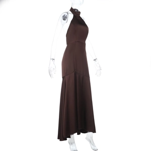 Detail of chocolate satin halter dress showing elegant side slit and glossy texture