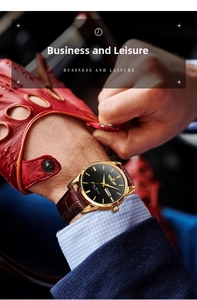 Detail of men's quartz watch with brown leather strap and dual calendar display dial