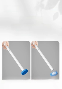 Detail of disposable toilet brush with button-lock handle and blue sponge head