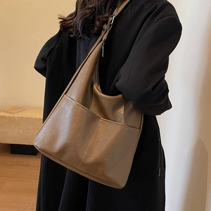 Brown leather tote bag for women, large capacity bucket style for office and daily commuting