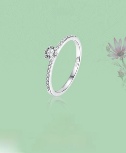 Detailed view of S925 sterling silver ring with six-prong set sparkling central diamond