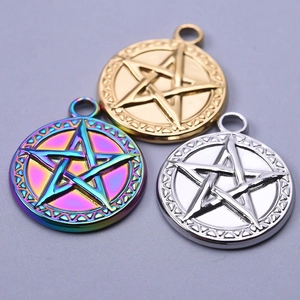 Close-up of star pendants in gold, silver and rainbow finishes for jewelry making