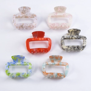 Set of 6 colorful 6cm rectangle PVC hair claws with trendy marble and floral patterns