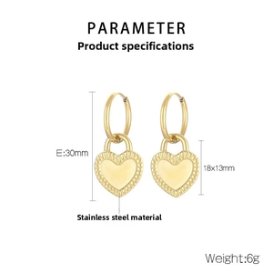 Detail view of gold stainless steel hoop earrings with double-sided heart charms