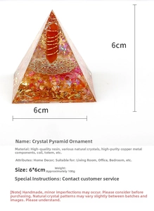Detail of 6cm Orgone pyramid with orange crystal pillar and copper coils for home decor