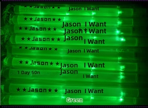 Group of green LED glow sticks for concerts with bright glowing effect on black background
