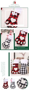 Detail of checkered pet paw Christmas stockings with plush cuff and bone shaped charm