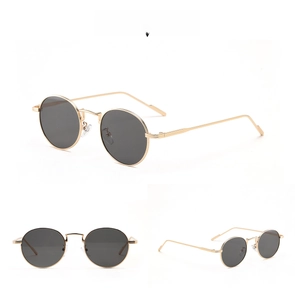 Detailed views of vintage round gold metal frame sunglasses with dark grey lenses