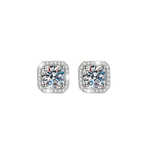 Macro detail of silver halo square stud earrings with central round moissanite