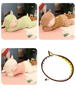 Detail of soft plush sheep pillows in green, brown, and white with heart embroidery