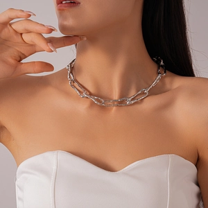 Detail of silver irregular textured chunky chain necklace with liquid metal finish