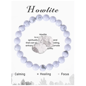 Detail of white howlite beaded bracelet with natural grey veins and calming stone properties