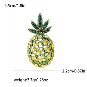 Sparkling yellow pineapple brooch with green rhinestones, dimensions 4.5cm x 2.2cm