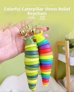 Macro view of flexible colorful slug keychain with a golden bell and ring attachment