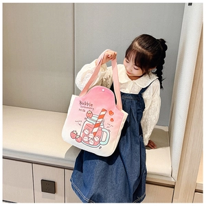 Detail of pink strawberry milk canvas bag with cute cartoon prints and button closure