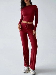 Detail of burgundy Y2K long sleeve crop top and drawstring wide leg pants set