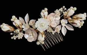 Detail of bridal hair comb with gold alloy leaves, white ceramic flowers and pearls