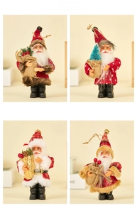 Detail of four Santa Claus plush figurines in red suits with varied gift baskets