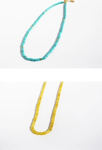 Detail of Lapis Lazuli beaded necklace with blue and yellow stones and gold spacers